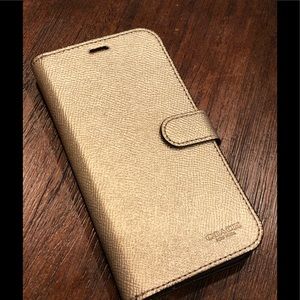 COACH Folio iPhone X case, gold color.